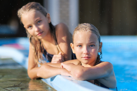 portrait of two girls of girlfriends on a summer natureの写真素材
