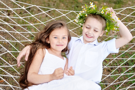 Portrait of a boy and girl in summerの写真素材