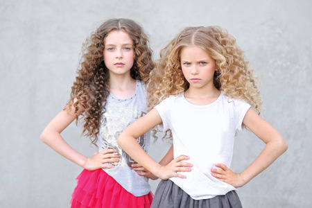 portrait of two girls of girlfriends on a summer natureの写真素材