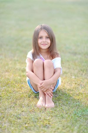 portrait of little girl outdoors in summerの写真素材