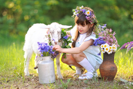 portrait of a beautiful little girl in summerの写真素材
