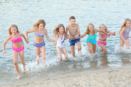 Portrait of happy children on nature in summerの写真素材