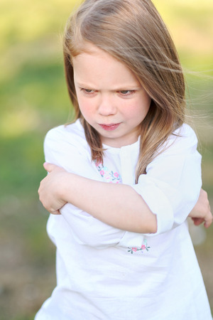 portrait of little girl outdoors in summer