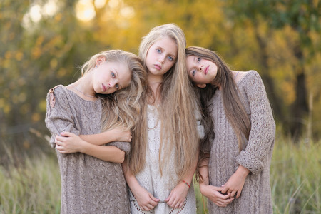 Portrait of three girlfriends on the natureの写真素材