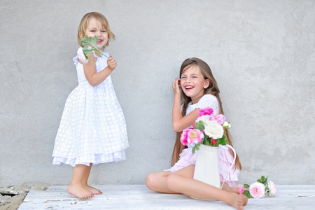 portrait of two girls of girlfriends on a summer natureの写真素材