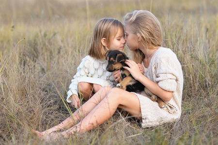 portrait of two girls of girlfriends on a summer natureの写真素材