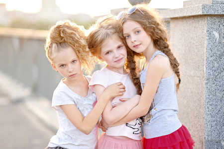 Portrait of three girlfriends on the natureの写真素材