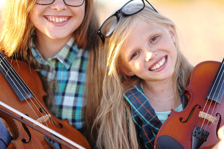 portrait of two girls of girlfriends on a summer natureの写真素材