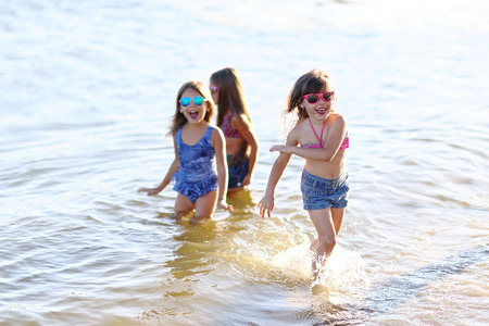 Portrait of three girlfriends on the natureの写真素材