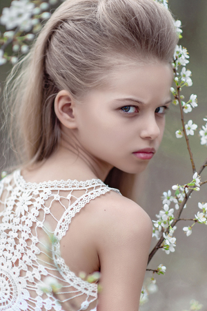 portrait of little girl outdoors in spring;の写真素材