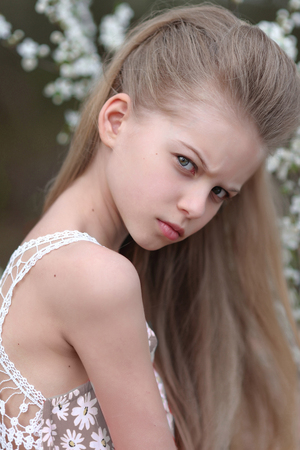 portrait of little girl outdoors in spring;の写真素材