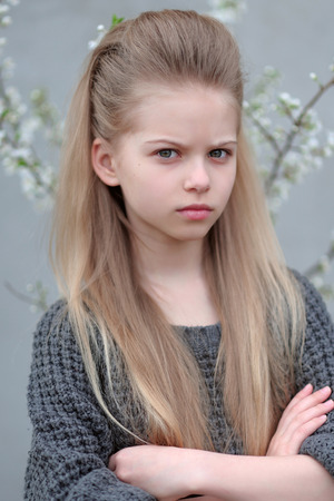 portrait of little girl outdoors in spring;の写真素材
