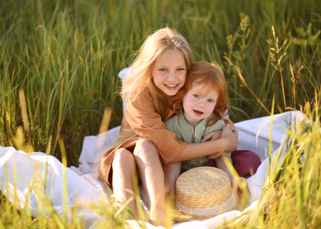 Portrait of a boy and girl  in summerの写真素材