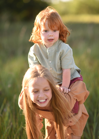 Portrait of a boy and girl  in summerの写真素材
