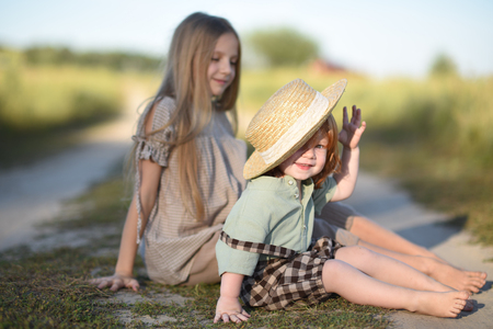 Portrait of a boy and girl  in summerの写真素材