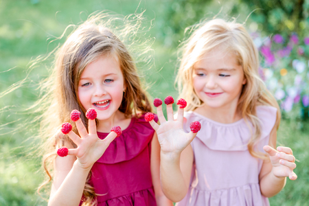 portrait of two girls of girlfriends on a summer natureの写真素材