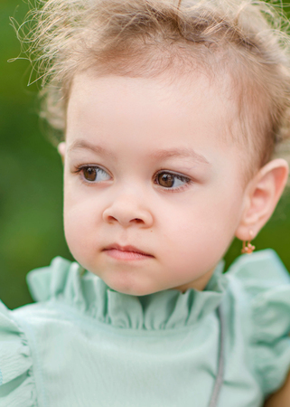 portrait of little girl outdoors in summerの写真素材