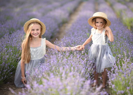 portrait of two girls of girlfriends on a summer natureの写真素材