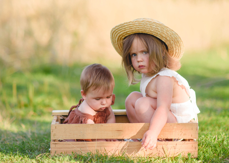 portrait of two girls of girlfriends on a summer natureの写真素材