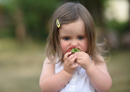 portrait of little girl outdoors in summerの写真素材