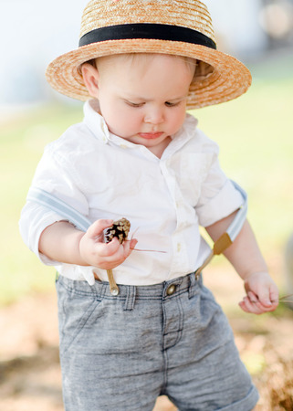 portrait of a Little boy playing in summer natureの写真素材
