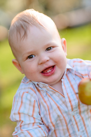 portrait of a Little boy playing in summer natureの写真素材
