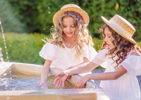 portrait of two girls of girlfriends on a summer natureの写真素材