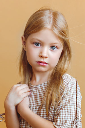 portrait of a little fashionable girl in the studio