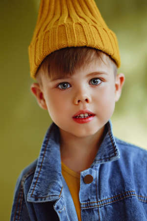 portrait of a fashionable little boy in the studioの写真素材