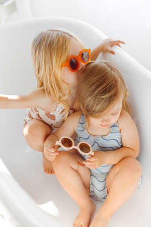 portrait of two girls sisters in studio