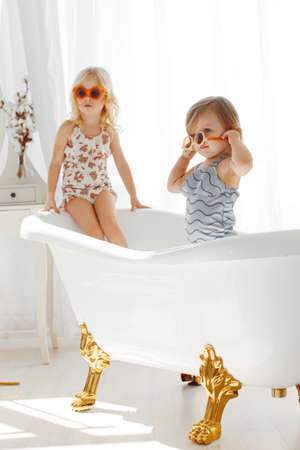 portrait of two girls sisters in studio