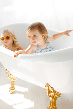 portrait of two girls sisters in studioの写真素材