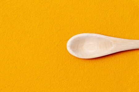 Turmeric powder is orange in color. Natural, useful healing spice from the East.の写真素材