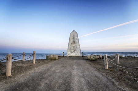 The obelisk near the lighthouse on Portland Bill near Weymouth on Dorset's Jurassic coastline.の写真素材