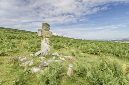 An ancient granite stone cross on a hillside on Bodmin Moor in Cornwallの写真素材