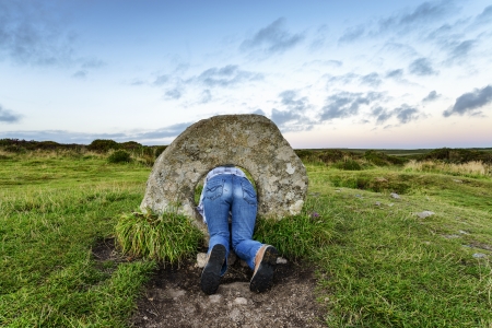 The Men-an-Tol standing stones Near Penzance in Cornwall, local legend says that if a woman passes backwards through the holded stone seven times on a full moon she will soon become pregnant のeditorial素材