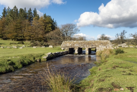 An old stone bridge over Walla Brook near Bellever on Dartmoor National Park in Devon