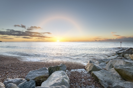 The beach and shoreline at Sidmouth on the south coast of Devonの写真素材