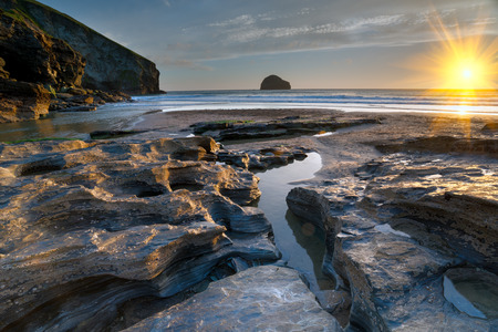 Rock pools at low tide on the beach at Trebarwith Strand on the north coast of Cornwallの写真素材