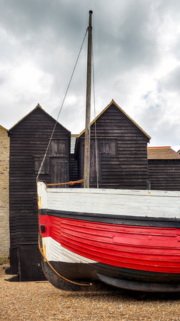 Tall thin traditional wooden fishing net huts at the Stade in Hastings, East Sussexの写真素材