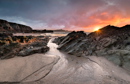 Sunset at Lusty Glaze beach at Newquay in Cornwall