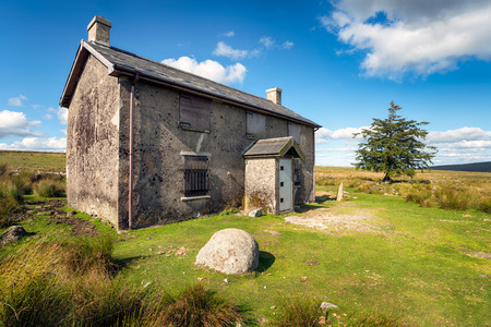 A derelict and abandoned farmhouse at Nun's Cross a remote part of Dartmoor National Park near Princetown in Devonの写真素材