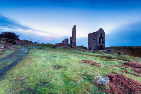 Old abandoned copper mine workings and engine houses at Caradon hill on Bodmin Moor in Cornwallの写真素材