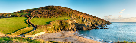A panoramic view from the Southwest Coast Path as it passes Hemmick Beach near Gorran Haven on the...