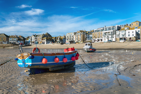 Fishing boats on the seafront at St Ives a picturesque coastal town in Cornwallの写真素材