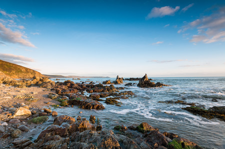 The beach at Portweinkle in Cornwall, looking out toward the Rame peninsula