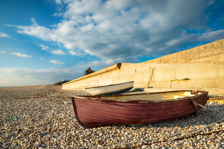 Fishing boats at Chesil Cove on the eastern edge of Chesil Beach in Portland, Dorsetの写真素材