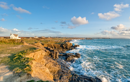 High tide at Boobys Bay beach in Cornwall looking out towards neighbouring Constantine Bayの写真素材