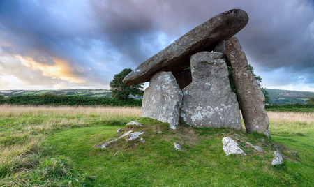 Trethevy Quoit under a moody sky on Bodmin Moor in Cornwall, an impressive Neolithic dolmen burial chamber that stands nearly nine feet tallの写真素材