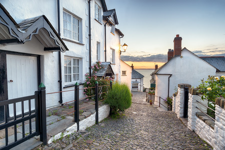 A narrow cobbled street lined with pretty cottages at Clovelly in north Devonの写真素材